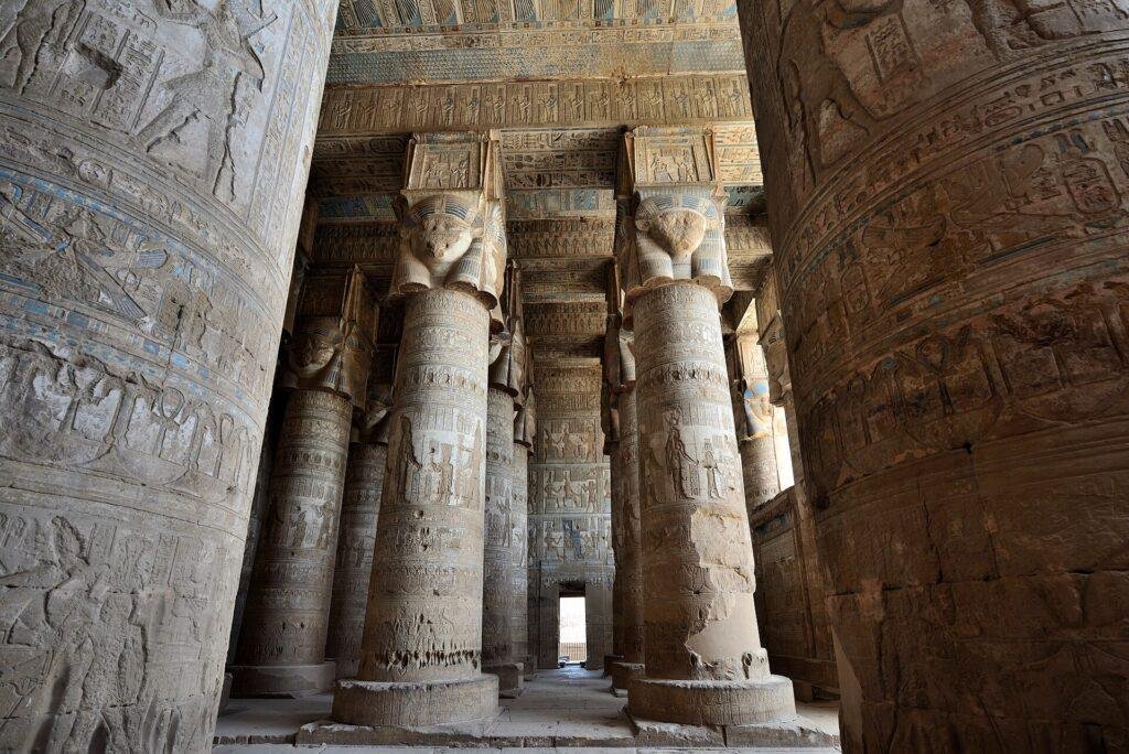 Hathor-headed columns inside Dendera temple on the Dendera and Abydos day trip from Luxor