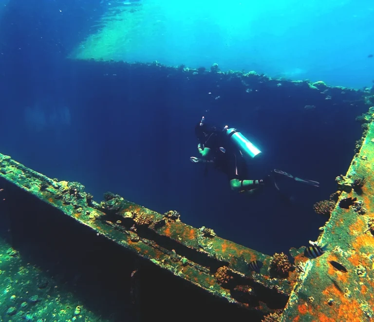 Scuba diver exploring a wreck while diving in Hurghada, Red Sea