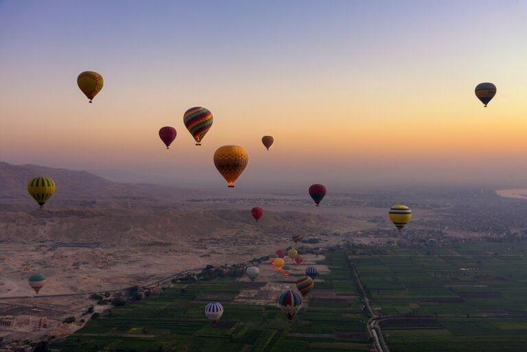 Hot air balloons over the Valley of the Kings in Luxor at sunrise