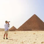 Is it safe to travel to Egypt - tourist enjoying the pyramids