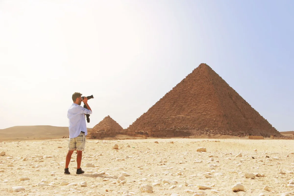 Is it safe to travel to Egypt - tourist enjoying the pyramids