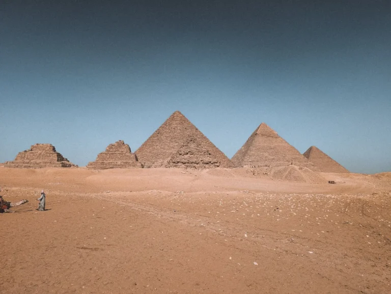 The Great Pyramids of Giza under a clear blue sky, Cairo Egypt