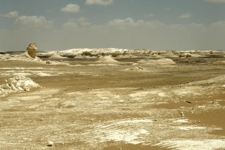 white desert egypt - chalk rock formations at sunset