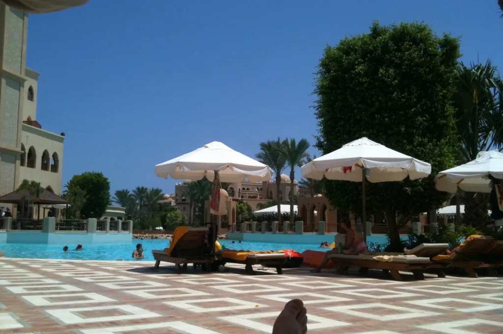 Red Sea resort pool with umbrellas, the heart of all inclusive New Year holidays