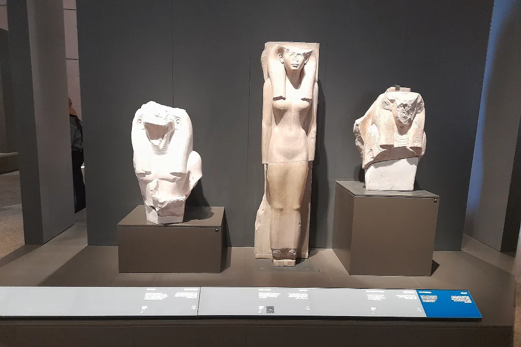 Royal statues in a Grand Egyptian Museum gallery case, part of a short All Saints' Day holiday in Egypt