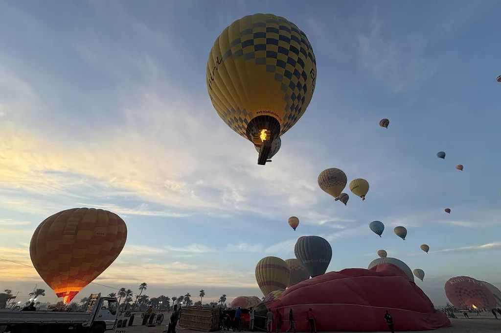 Sunrise hot air balloon ride above the Theban hills