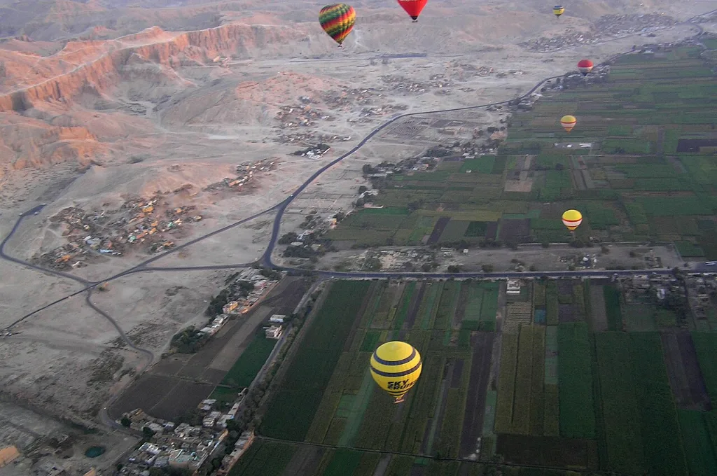 Hot air balloon Valley of the Kings landscape of desert cliffs