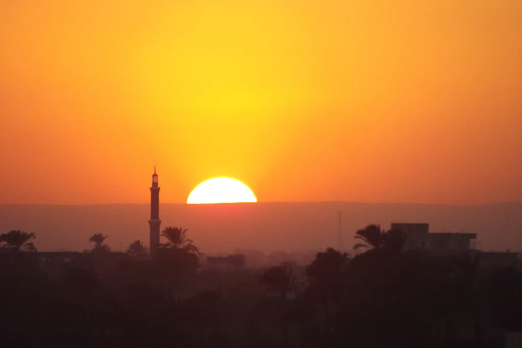 Sun setting over the Luxor West Bank, the Theban realm of the dead where the Beautiful Festival of the Valley ended