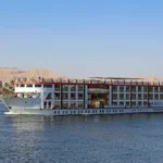 Nile cruise ship sailing past Luxor, one of the best Christmas vacations