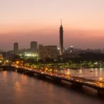 Cairo skyline at dusk with the Nile and Cairo Tower glowing, a festive view for cairo at christmas