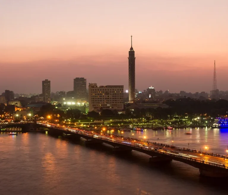 Cairo skyline at dusk with the Nile and Cairo Tower glowing, a festive view for cairo at christmas