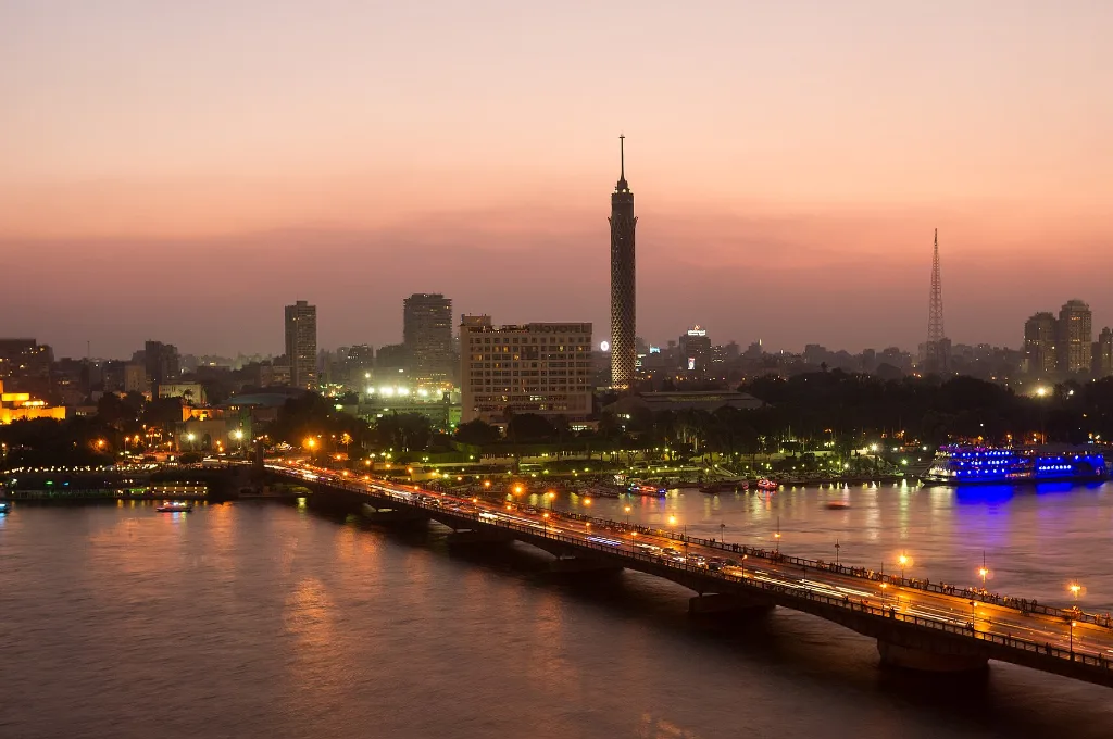 Cairo skyline at dusk with the Nile and Cairo Tower glowing, a festive view for cairo at christmas