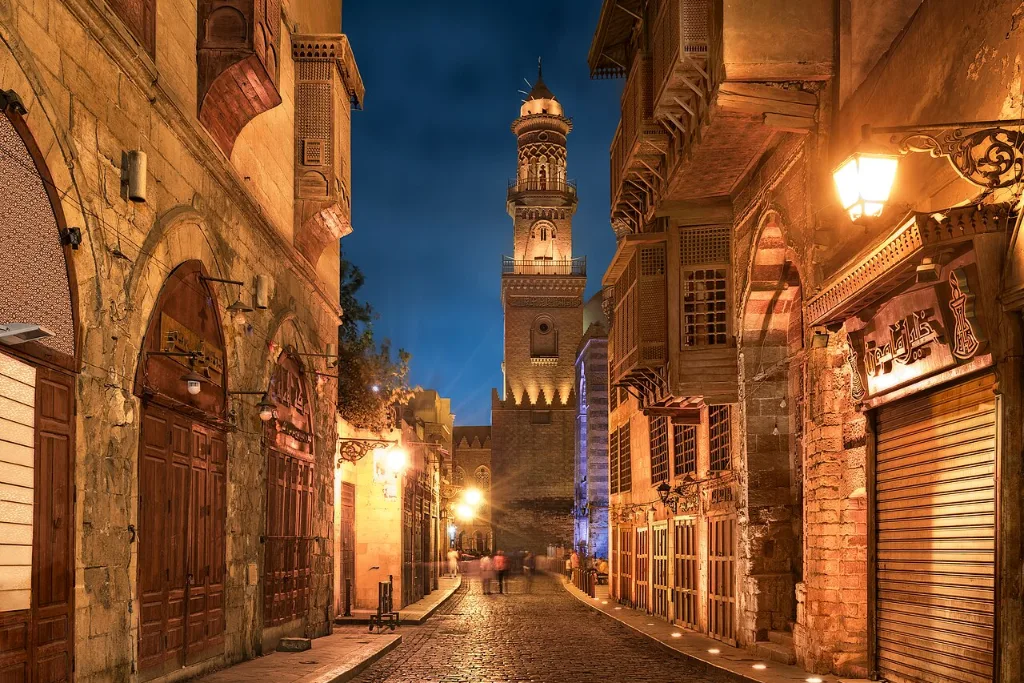Al-Muizz Street in Cairo at dusk, a lantern-lit stop on a Christmas getaway