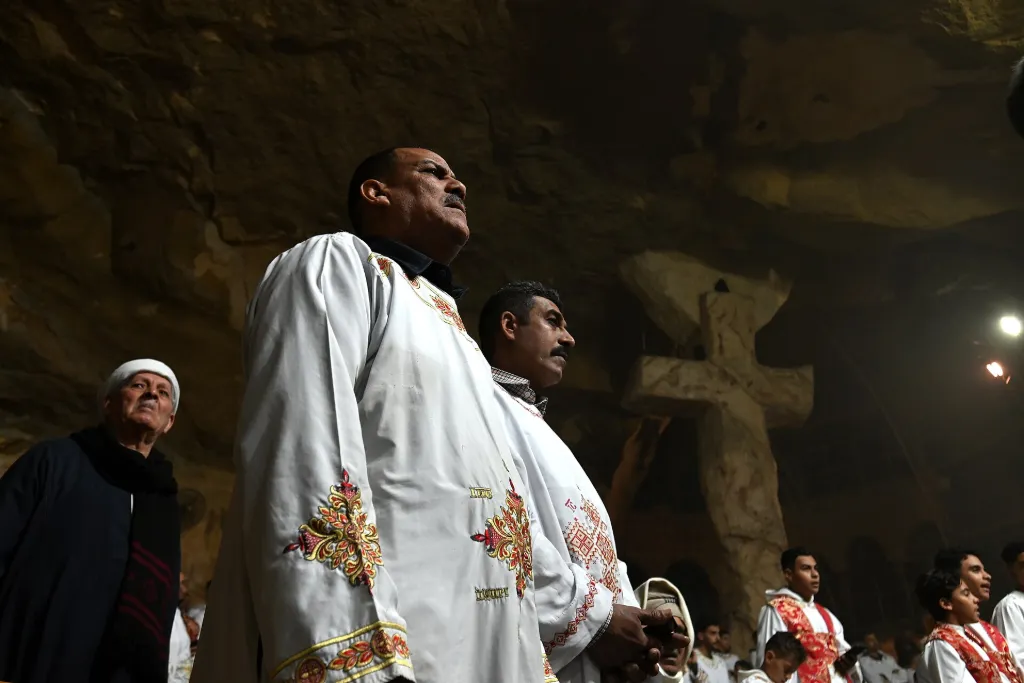 Coptic Christmas mass with priests in vestments at a Cairo church
