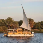Dahabiya sailing the Nile at golden hour