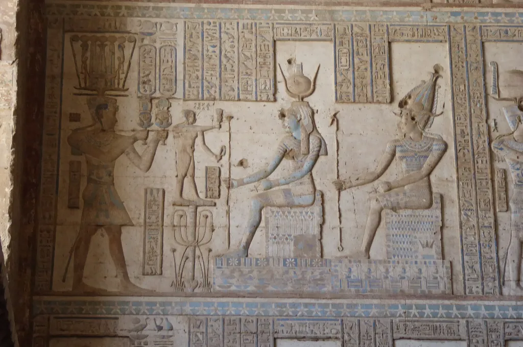 Carved relief of Ptolemy before Isis and Osiris at Dendera - New Year In Ancient Egypt