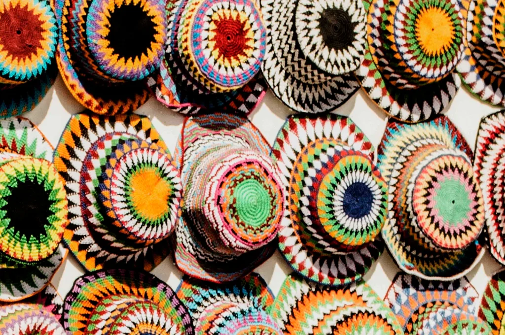 Egyptian traditional clothes: colourful handmade Nubian skullcaps on display in Aswan