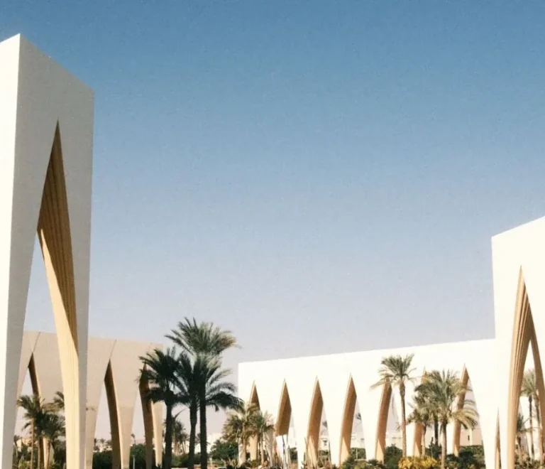 White arched buildings beside a lagoon in El Gouna, Egypt