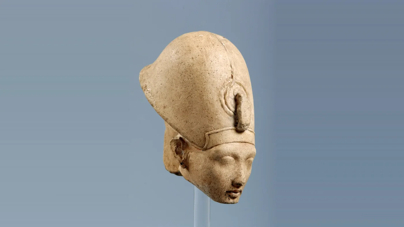 Sculpted head of King Akhenaten wearing a crown, facts about King Akhenaten (view 2)