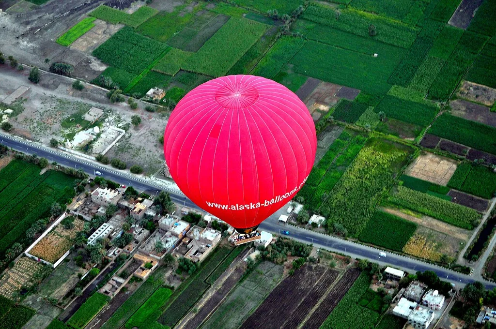 Romantic hot air balloon rides in golden Luxor morning light