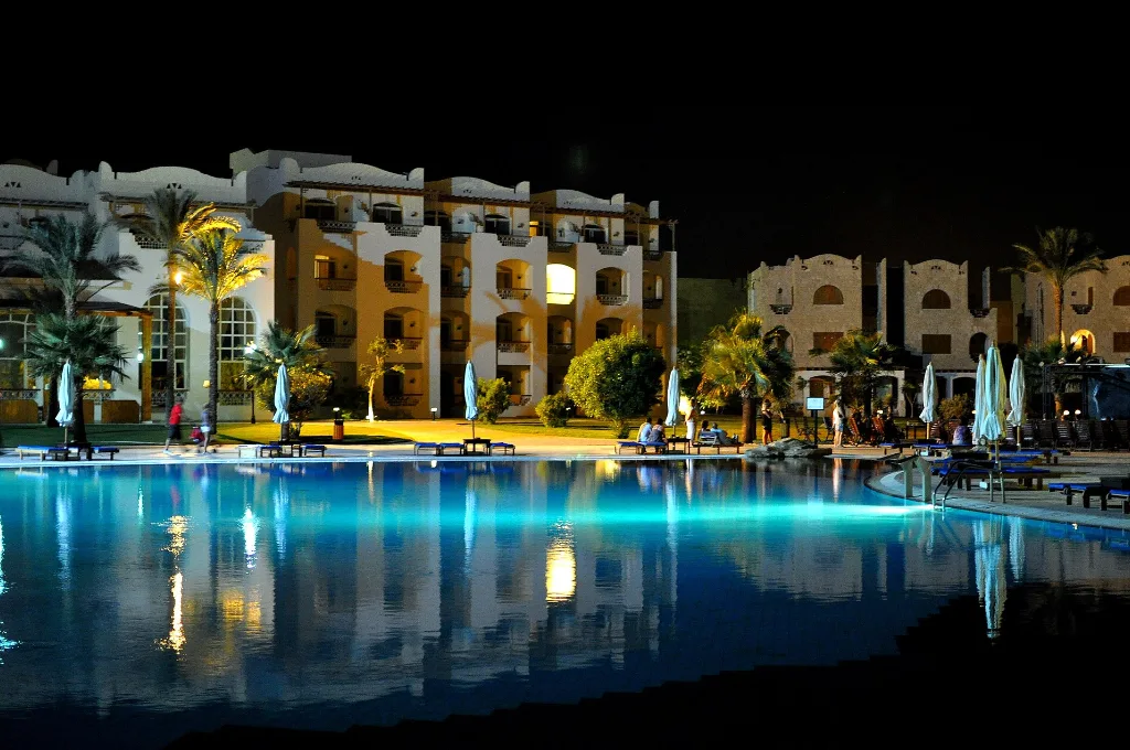 Resort pool glowing blue at night in Hurghada, a calm end to Hurghada Christmas holidays