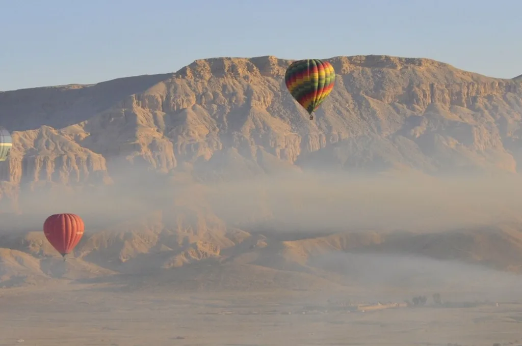 Luxor balloon price: a balloon silhouetted against the dawn sky over the Theban hills