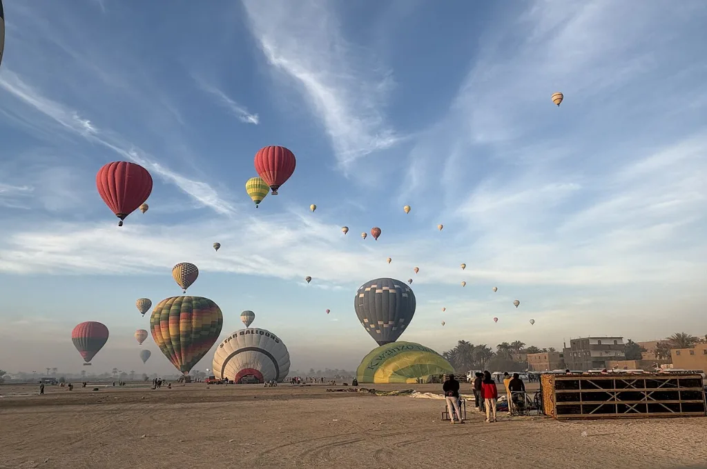 Sky full of balloons during last minute hot air balloon rides in Luxor