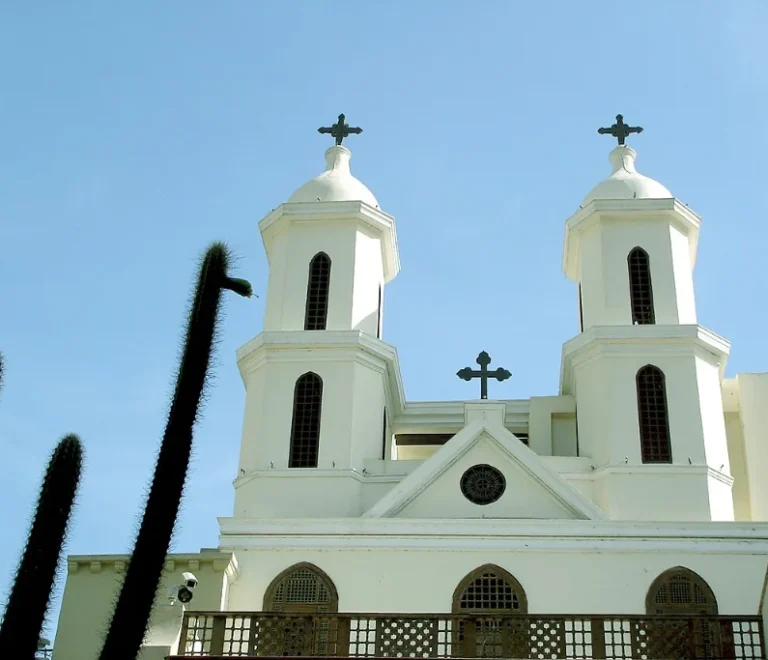 The Hanging Church in Cairo with twin white bell towers above the Coptic Cairo lane